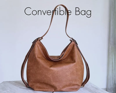 video of beige convertible hobo bag